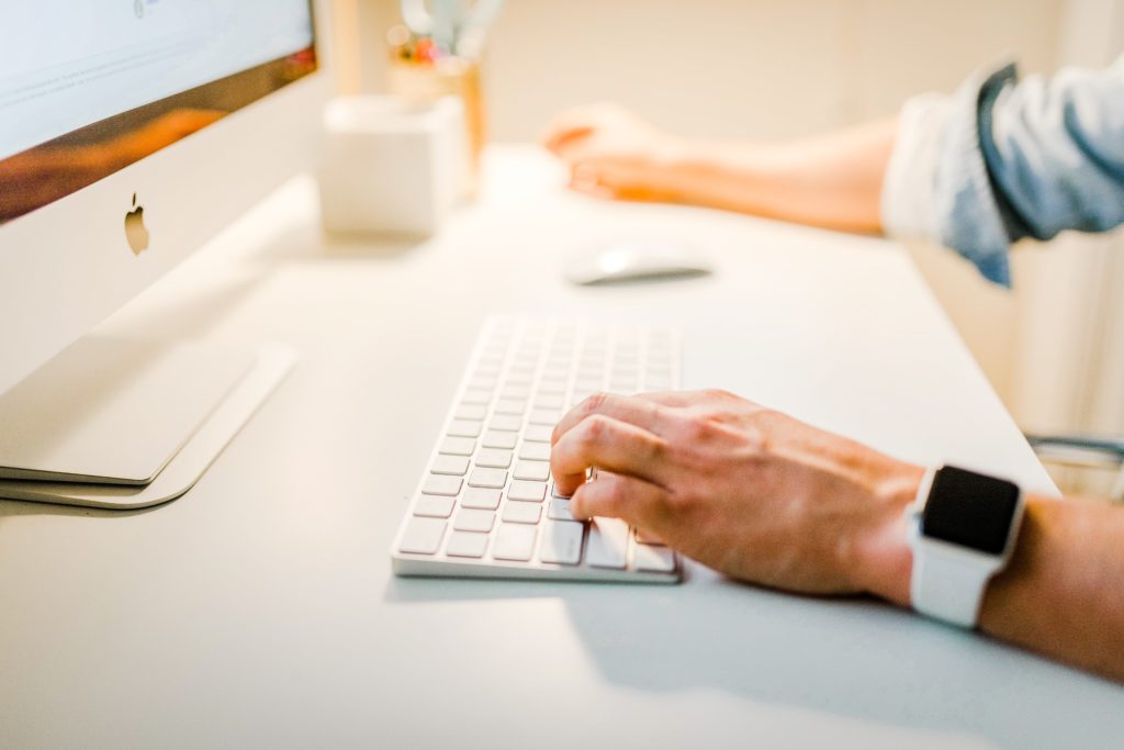 Man typing on a computer